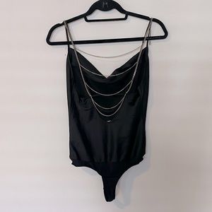 Bebe bodysuit w/ hanging silver chains on back